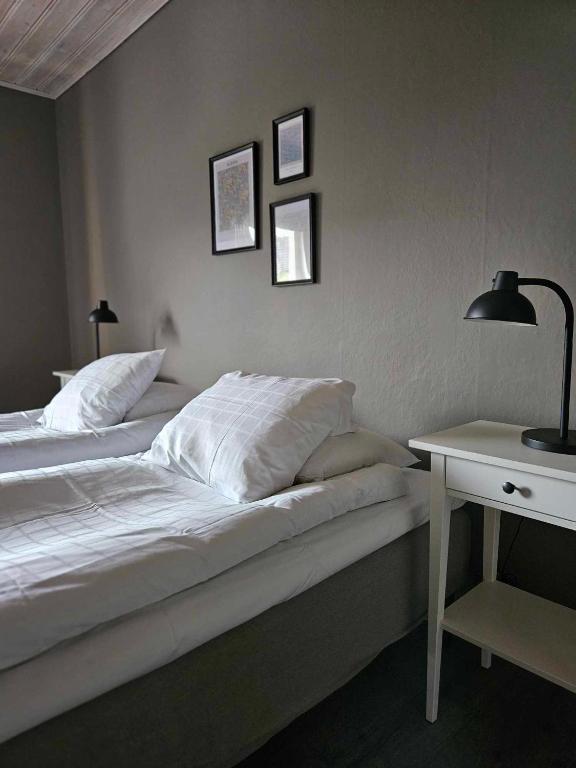 Postel nebo postele na pokoji v ubytování Lilla Älvbrogården i stan