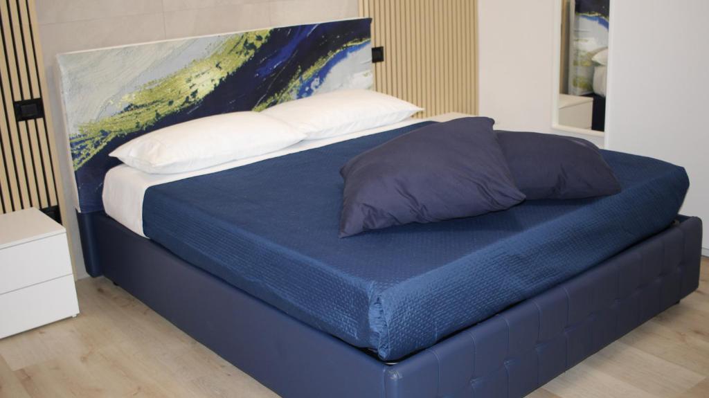 Un pat sau paturi într-o cameră la BARION