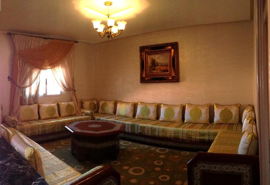 a living room with a couch and a window at Coopérative Village Jbel Moussa du Tourisme in Rcham