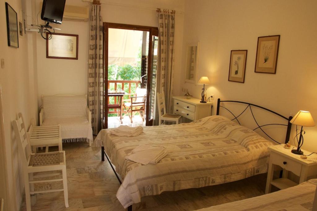 Postel nebo postele na pokoji v ubytování Mirto Apartments