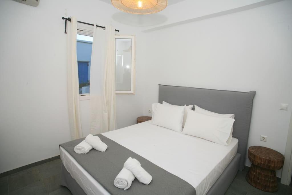 Кровать или кровати в номере Blue Paradise Agios Sostis