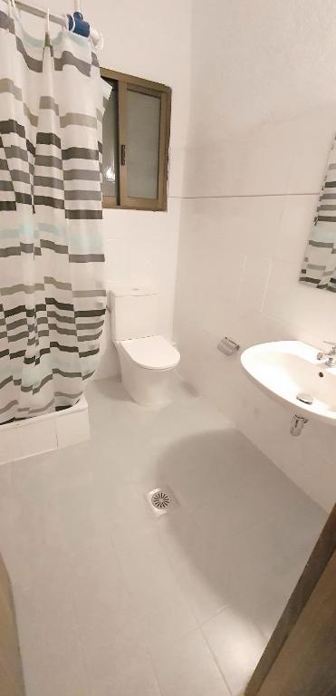 Koupelna v ubytování Hotel Pashos