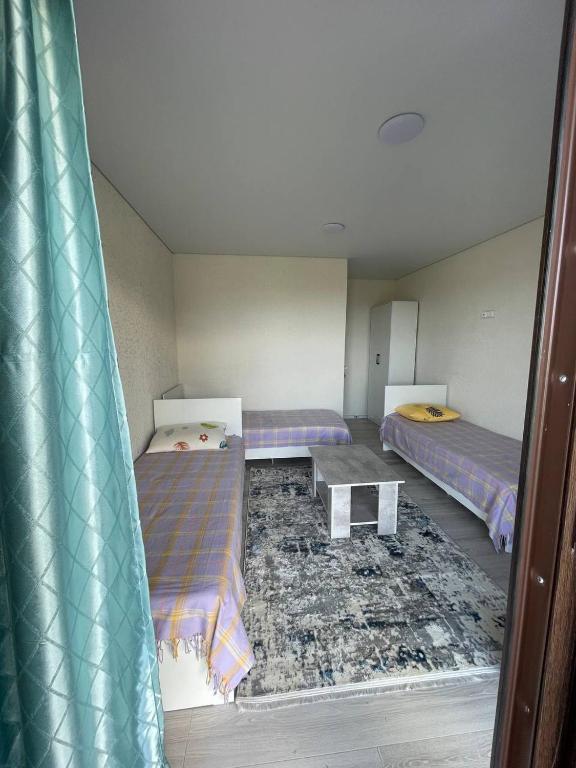 Postel nebo postele na pokoji v ubytování Шатман