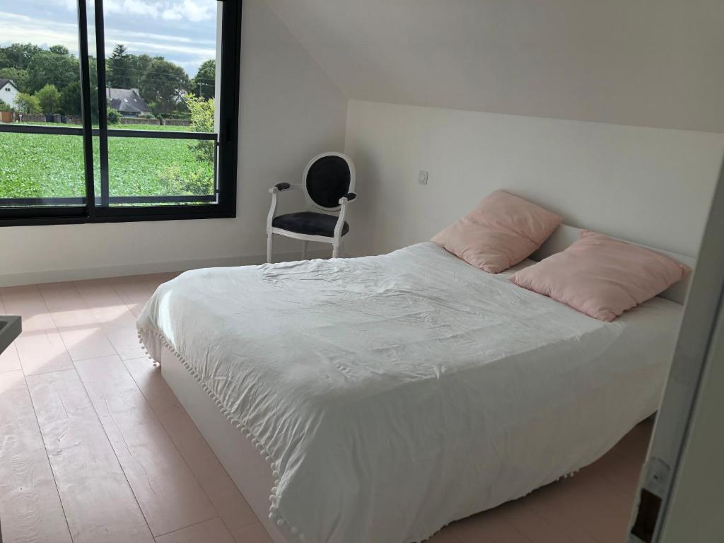 Postel nebo postele na pokoji v ubytování Chambre proche plage