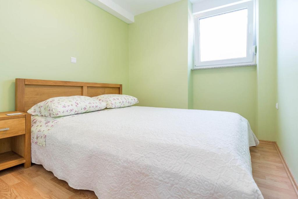 Łóżko lub łóżka w pokoju w obiekcie Apartment MiMa