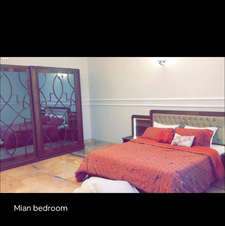 a bedroom with a bed and a large mirror at Quba luxury in Medina