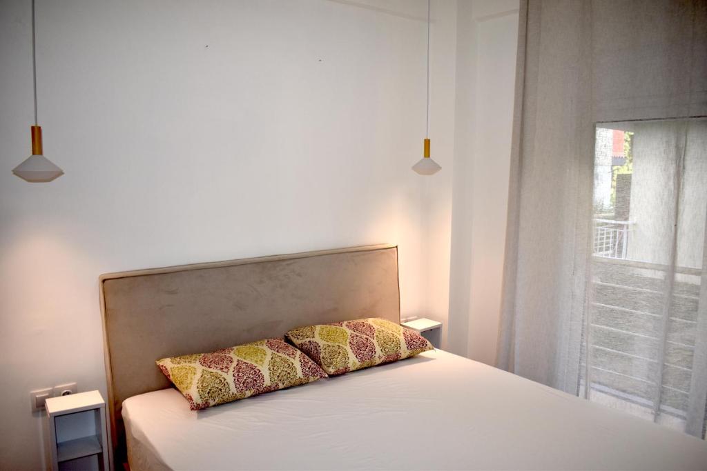Postel nebo postele na pokoji v ubytování Jasmine Apartment