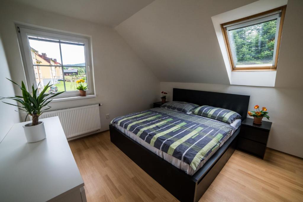 Postel nebo postele na pokoji v ubytování Apartmány Hasičárna