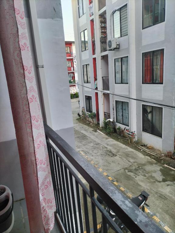 a view from a balcony of a building at Cozy 2BR Deca Homes, Near Airport, SM Jmall, SM Cebu & Parkmall in Mandaue City