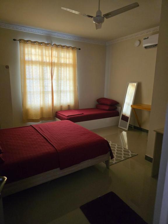 Postel nebo postele na pokoji v ubytování Maagali Inn