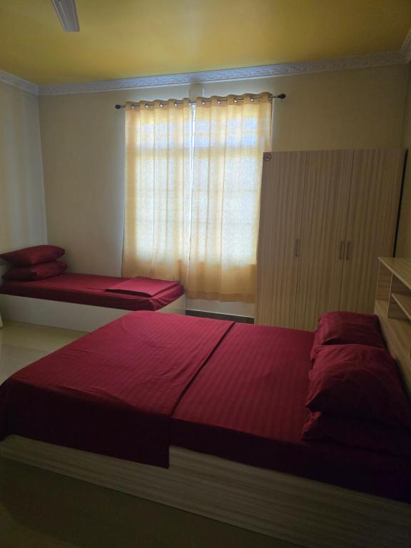 Postel nebo postele na pokoji v ubytování Maagali Inn