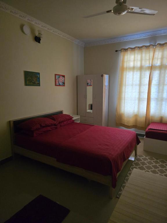 Postel nebo postele na pokoji v ubytování Maagali Inn