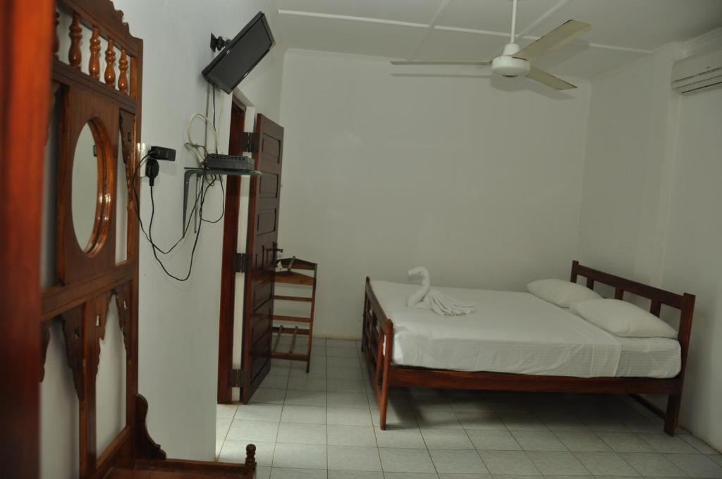 Postel nebo postele na pokoji v ubytování Sujatha Tourist Rest