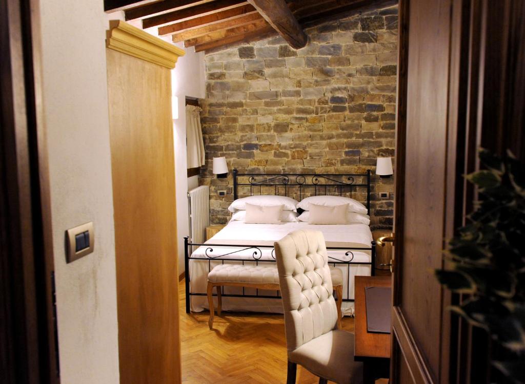 A bed or beds in a room at ARIA DI CASA APARTMENT