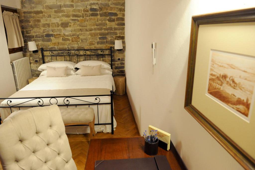 A bed or beds in a room at ARIA DI CASA APARTMENT