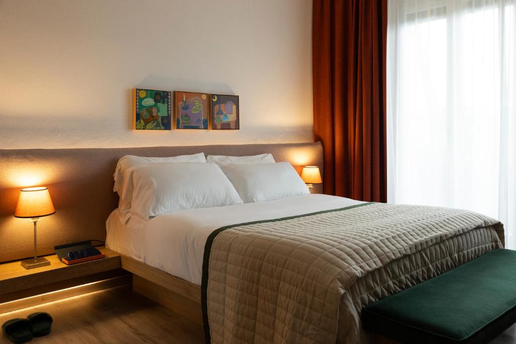 Postel nebo postele na pokoji v ubytování La Serena Hotel FDM