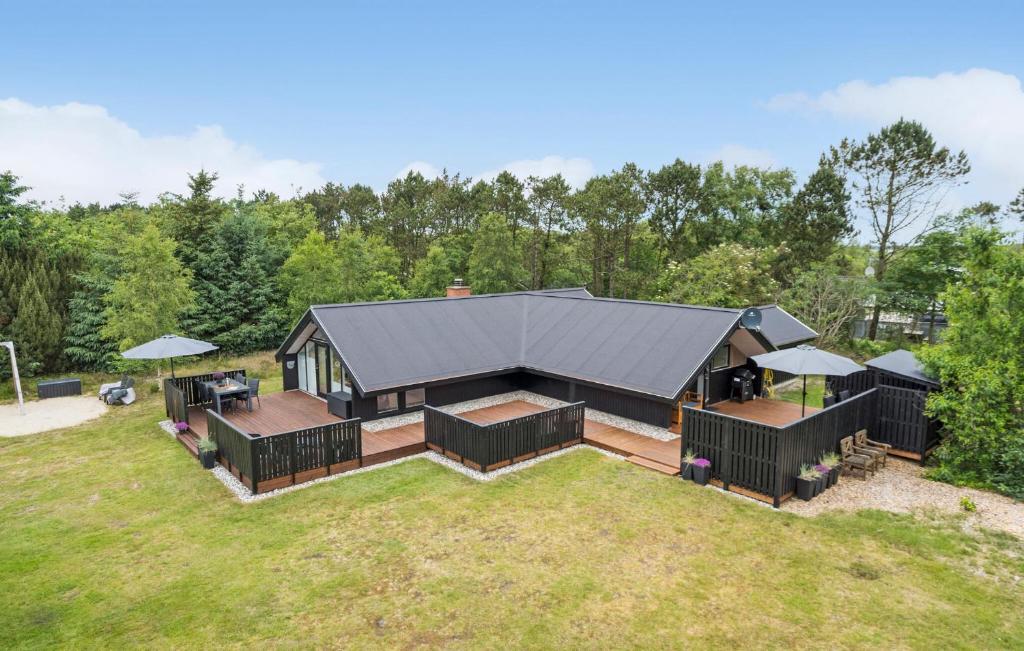 an aerial view of a home with a large backyard at Three-Bedroom Holiday Home In Ringkobing in Ringkøbing