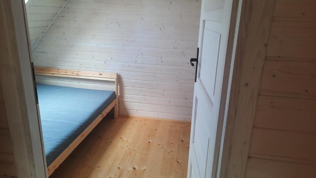 Postel nebo postele na pokoji v ubytování Domek nad morzem Jerzyk 506-385-791
