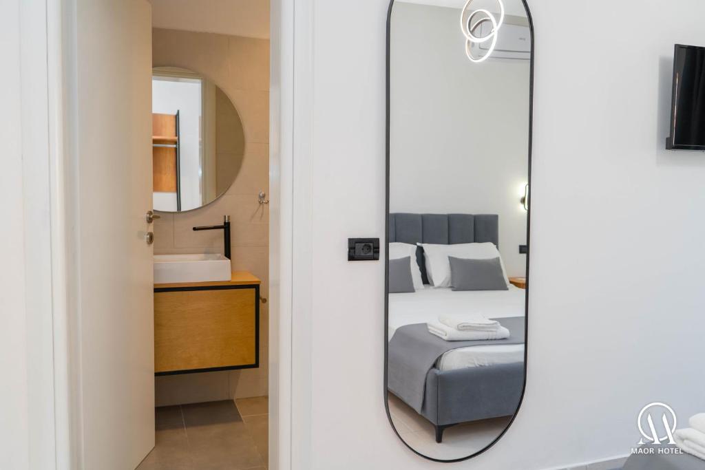 Postel nebo postele na pokoji v ubytování Maor Hotel