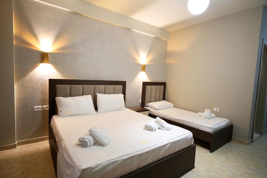 Postel nebo postele na pokoji v ubytování Hotel Erjuma