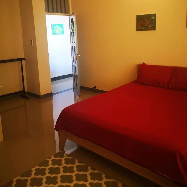 Postel nebo postele na pokoji v ubytování Maagali Inn