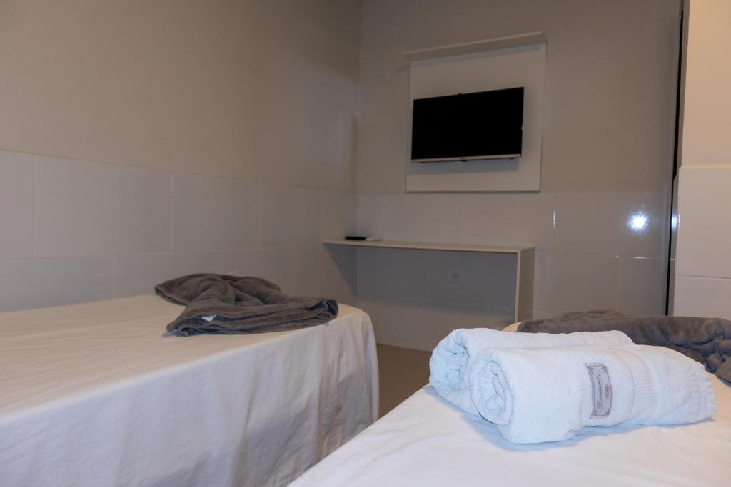 Postel nebo postele na pokoji v ubytování Honório Pousada-Caldas do Jorro BA