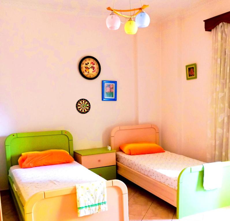 Ένα ή περισσότερα κρεβάτια σε δωμάτιο στο Floral Sweet Home