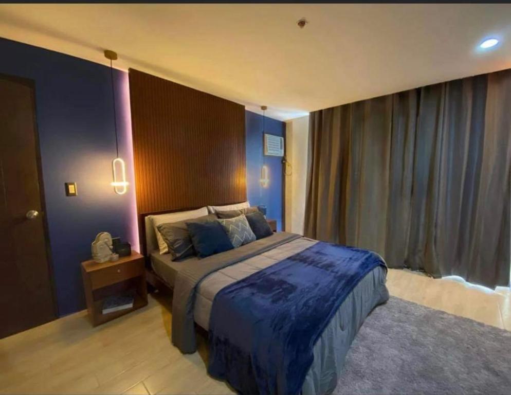 Ένα ή περισσότερα κρεβάτια σε δωμάτιο στο 2 Bedroom condo at La Fayette Megaworld