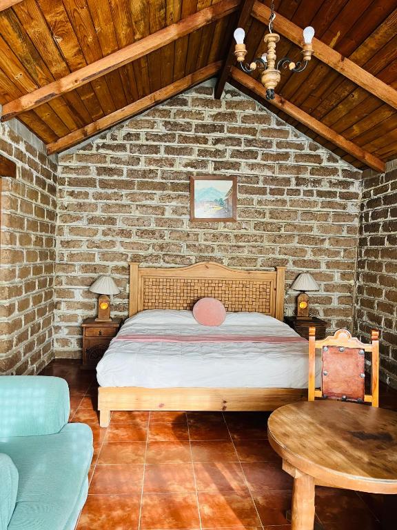 Postel nebo postele na pokoji v ubytování Cabañas Los Cactus