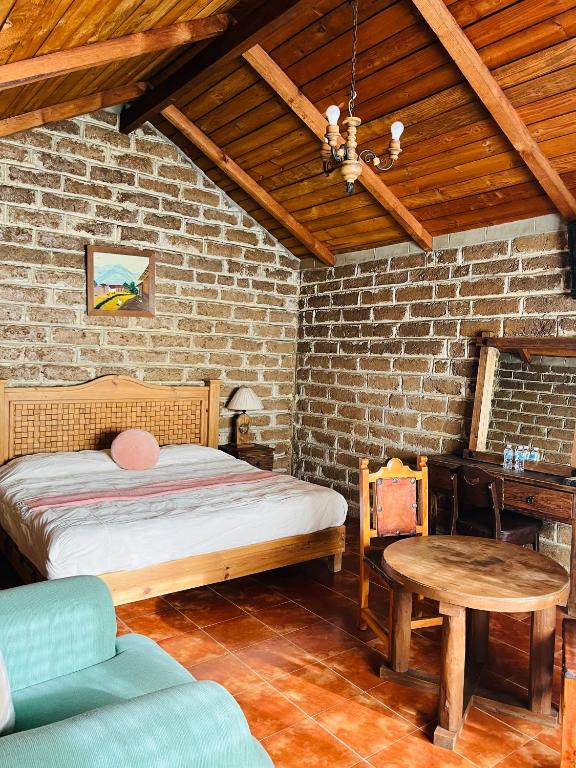Postel nebo postele na pokoji v ubytování Cabañas Los Cactus