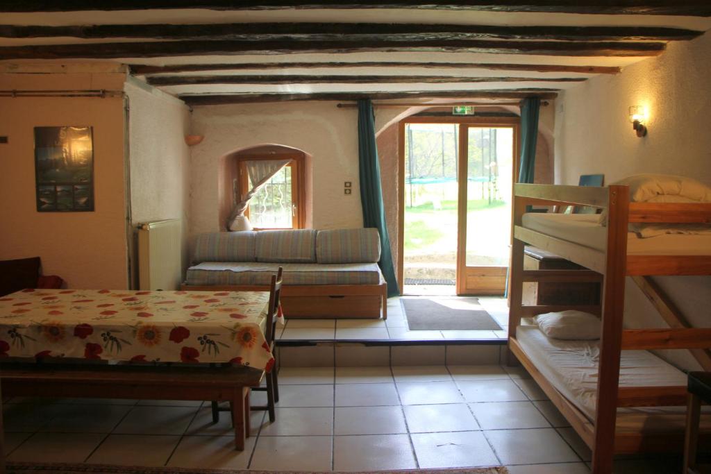 Postel nebo postele na pokoji v ubytování Gîte Le Moulin papillon