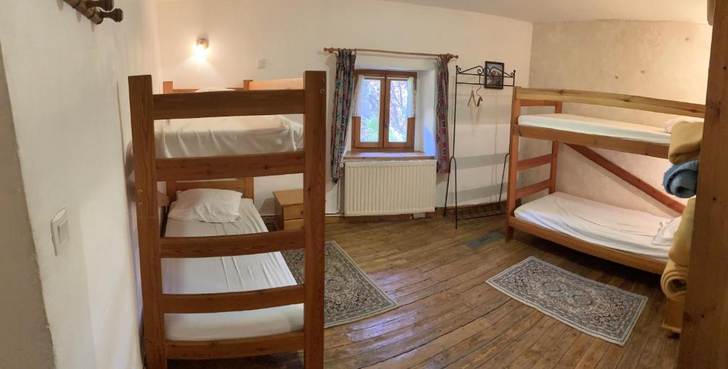 Postel nebo postele na pokoji v ubytování Gîte Le Moulin papillon