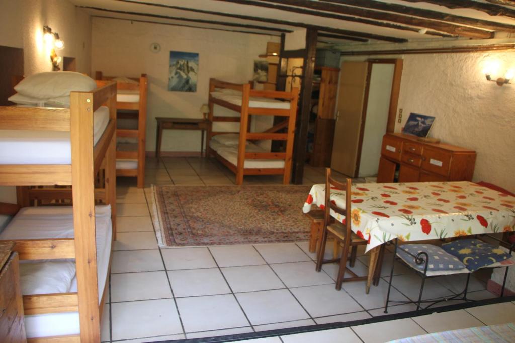Postel nebo postele na pokoji v ubytování Gîte Le Moulin papillon