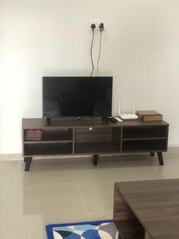TV a/nebo společenská místnost v ubytování Homestay Siti Klang