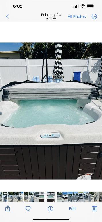 a bath tub with a pool in a backyard at Mathel and Mar in West Palm Beach
