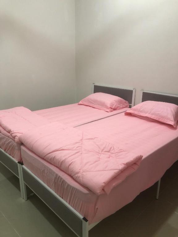 Postel nebo postele na pokoji v ubytování Homestay Siti Klang