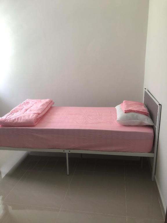 Postel nebo postele na pokoji v ubytování Homestay Siti Klang