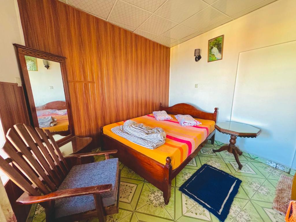 Postel nebo postele na pokoji v ubytování Lakshan View Resort
