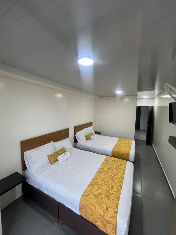 Postel nebo postele na pokoji v ubytování Hotel Olam Confort