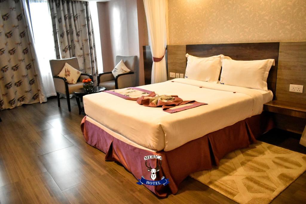 Postel nebo postele na pokoji v ubytování Merica Hotel