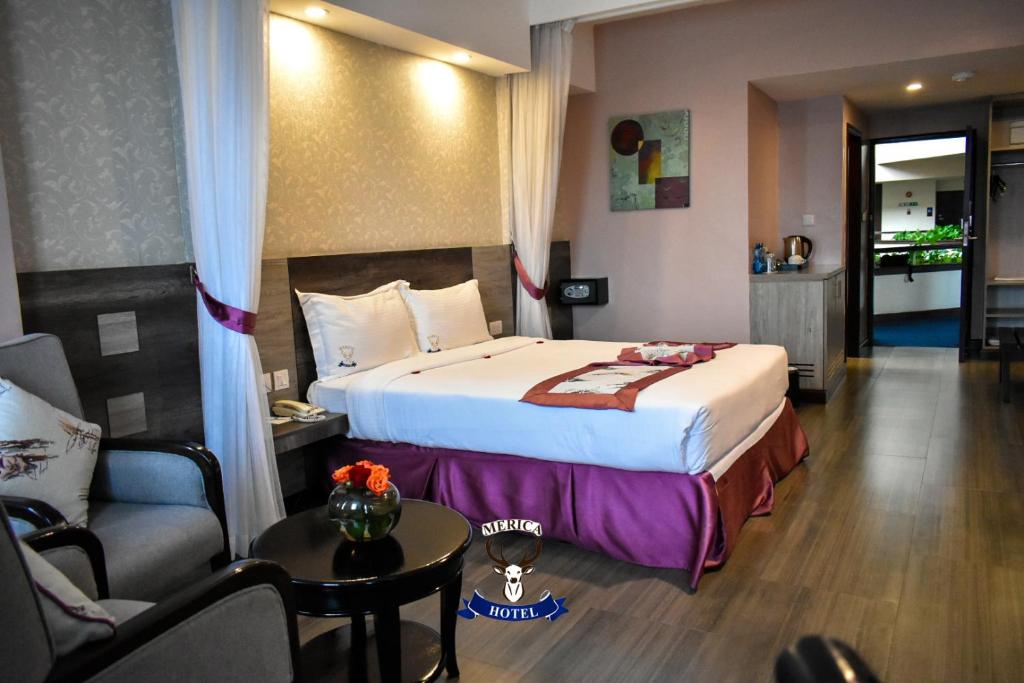Postel nebo postele na pokoji v ubytování Merica Hotel