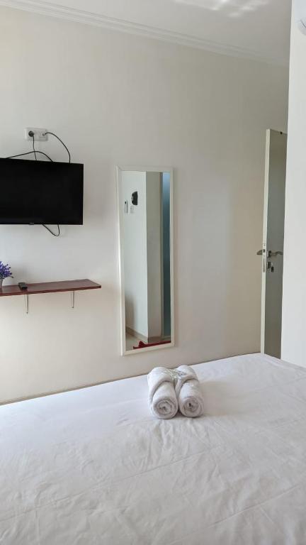 Postel nebo postele na pokoji v ubytování ARIMBI GUEST HOUSE