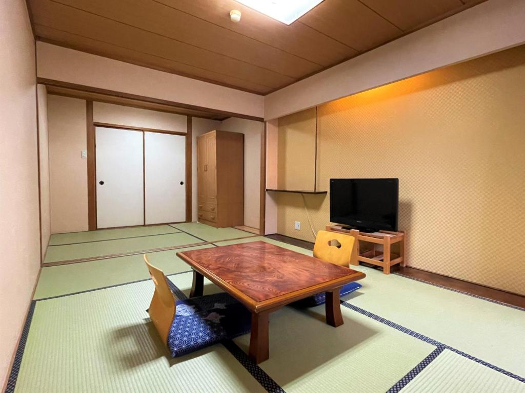 TV a/nebo společenská místnost v ubytování Dochu Land Shin Onsen