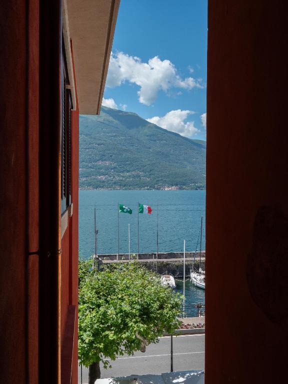 a view of a body of water from a building at Magnolia House in Bellano