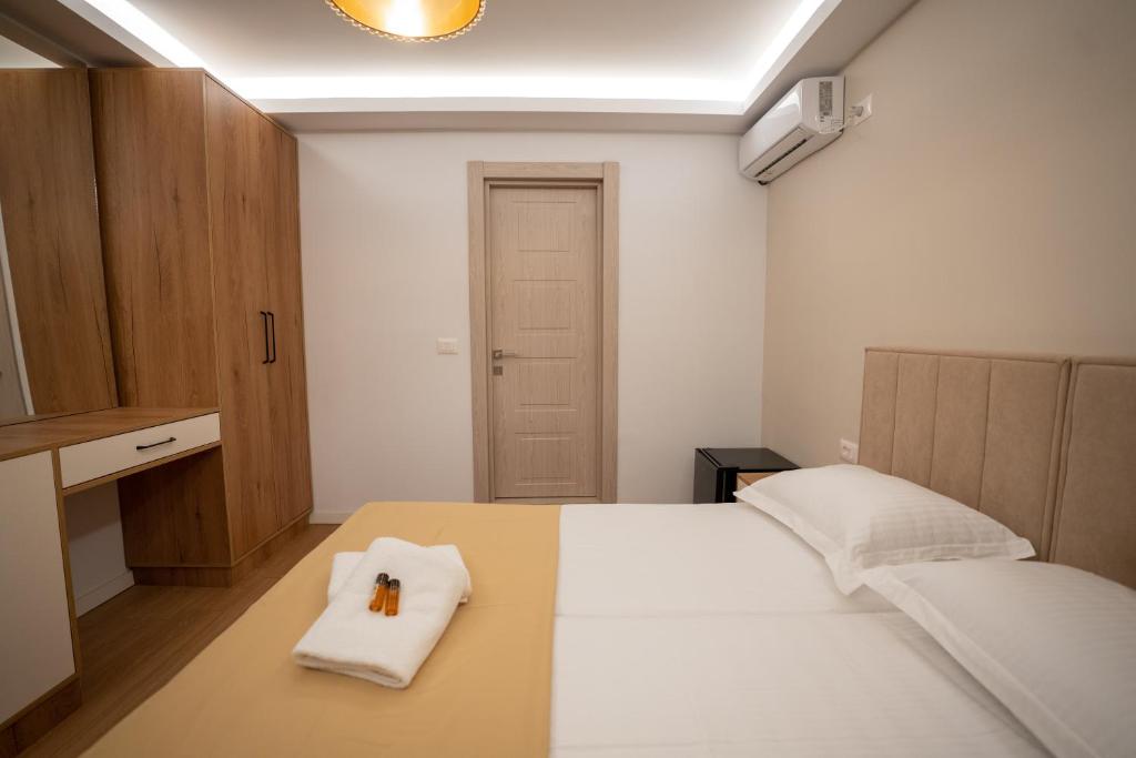 Postel nebo postele na pokoji v ubytování Illyria Hotel