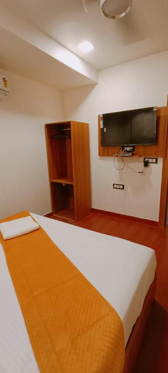 Postel nebo postele na pokoji v ubytování Hotel golden tree