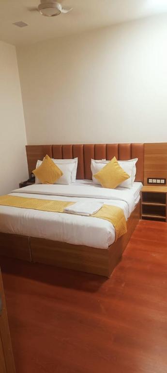 Postel nebo postele na pokoji v ubytování Hotel golden tree