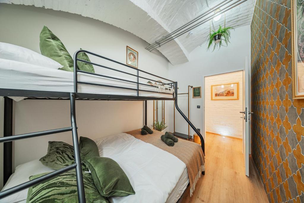Postel nebo postele na pokoji v ubytování GREEN Apartments