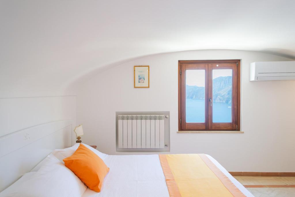 Postel nebo postele na pokoji v ubytování Residence Lì Galli