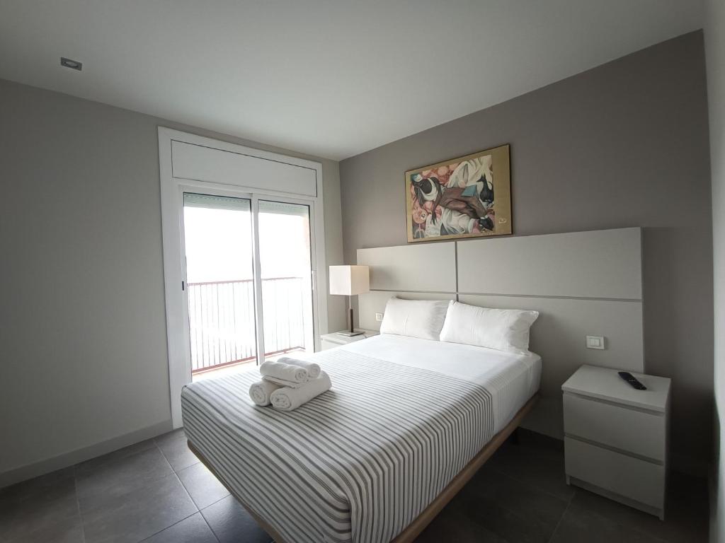 Posteľ alebo postele v izbe v ubytovaní Aiguaneu Apartaments Els Pins
